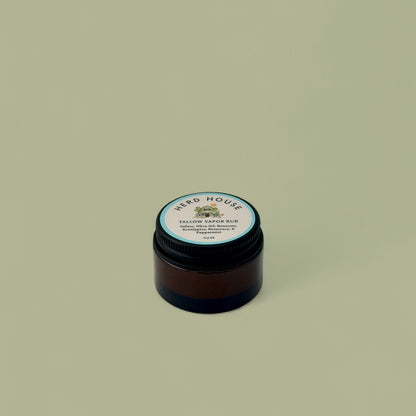 Grass-fed regenerative tallow vapor rub in an amber glass jar with natural essential oils